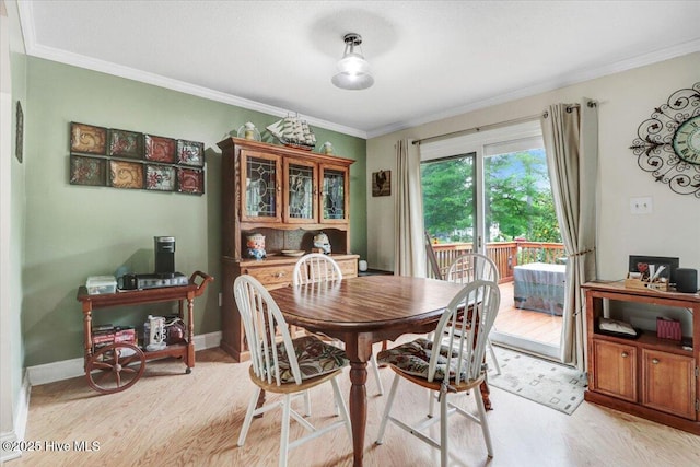 105 Harbor Dr, Washington, NC 27889 - dining area with light wood-style floors, crown molding, and baseboards