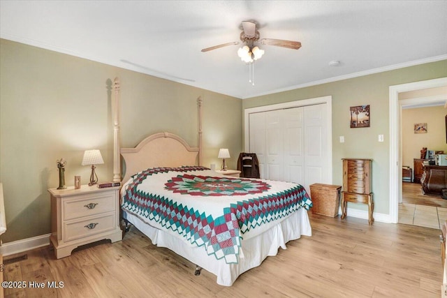 105 Harbor Dr, Washington, NC 27889 - bedroom featuring crown molding, a closet, baseboards, and light wood-style floors