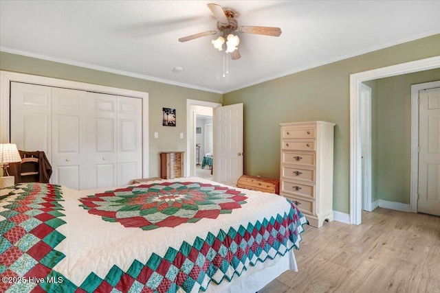 105 Harbor Dr, Washington, NC 27889 - bedroom with light wood-style floors, a closet, ornamental molding, baseboards, and a ceiling fan