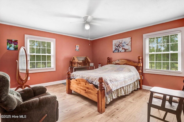 105 Harbor Dr, Washington, NC 27889 - bedroom with light wood finished floors, a ceiling fan, baseboards, and crown molding