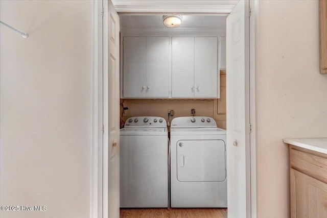 105 Harbor Dr, Washington, NC 27889 - clothes washing area featuring washing machine and clothes dryer and cabinet space
