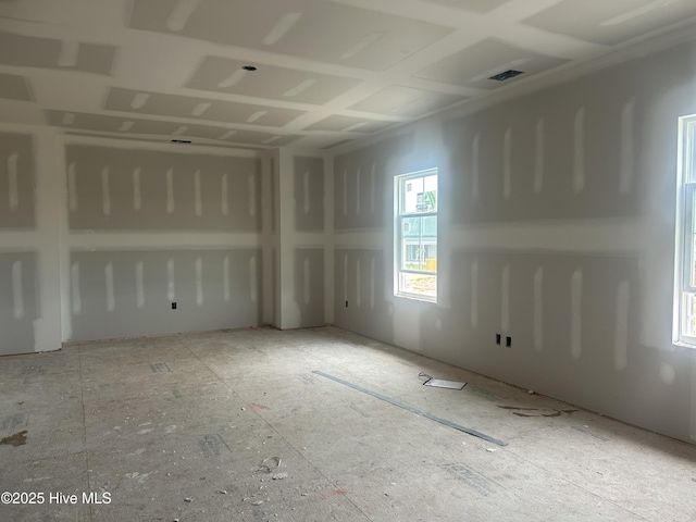 unfurnished room with visible vents