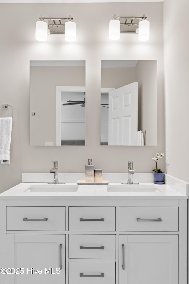 bathroom with a sink and double vanity