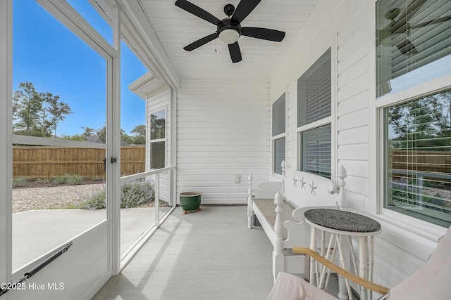 sunroom with a ceiling fan