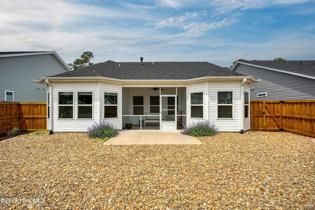 back of house featuring a ceiling fan, a patio area, a shingled roof, and a fenced backyard