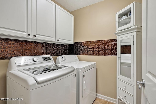 1005 Bellmark Ct, Leland, NC 28451 - laundry area with washing machine and clothes dryer, cabinet space, and wainscoting