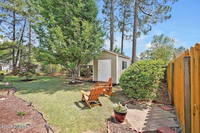 1005 Bellmark Ct, Leland, NC 28451 - view of yard with a storage unit, an outdoor structure, and a patio area