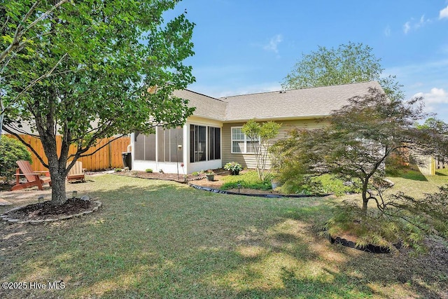 1005 Bellmark Ct, Leland, NC 28451 - back of house featuring a sunroom and a shingled roof