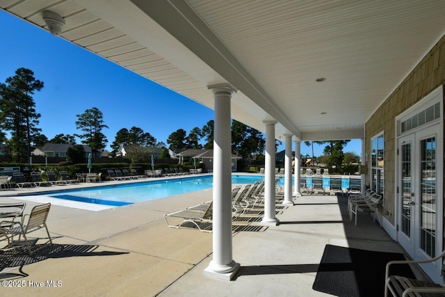 1005 Bellmark Ct, Leland, NC 28451 - community pool with french doors and a patio
