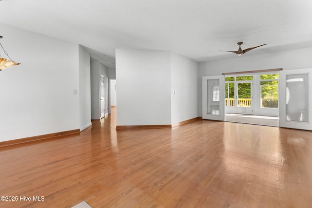 163 Middleton Dr, Hertford, NC 27944 - unfurnished living room with ceiling fan, wood finished floors, and baseboards