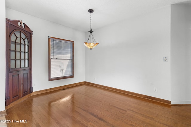 163 Middleton Dr, Hertford, NC 27944 - unfurnished room with baseboards and wood finished floors