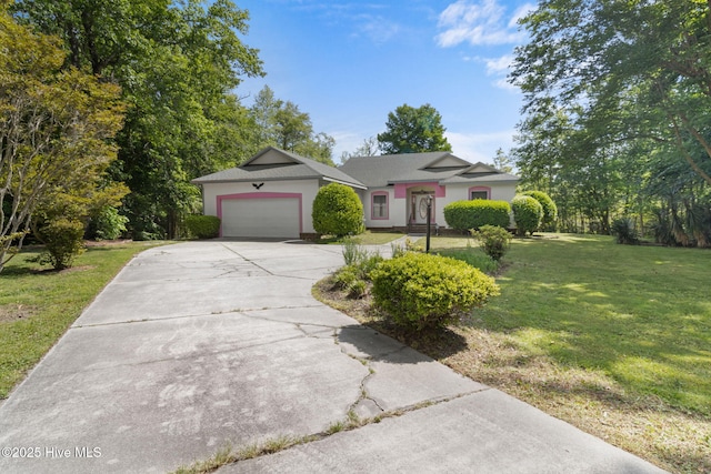 163 Middleton Dr, Hertford, NC 27944 - ranch-style house featuring a front yard, driveway, a garage, and stucco siding