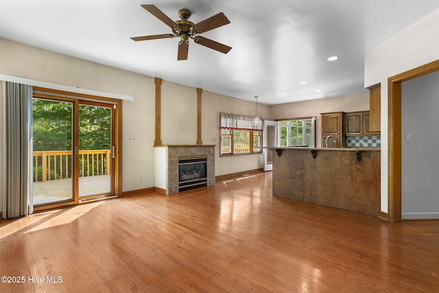 163 Middleton Dr, Hertford, NC 27944 - unfurnished living room with light wood-type flooring, ceiling fan, and baseboards