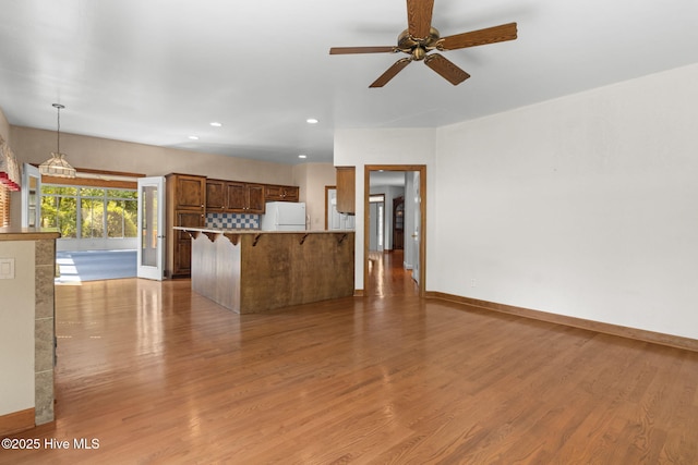 163 Middleton Dr, Hertford, NC 27944 - unfurnished living room with recessed lighting, a ceiling fan, wood finished floors, and baseboards