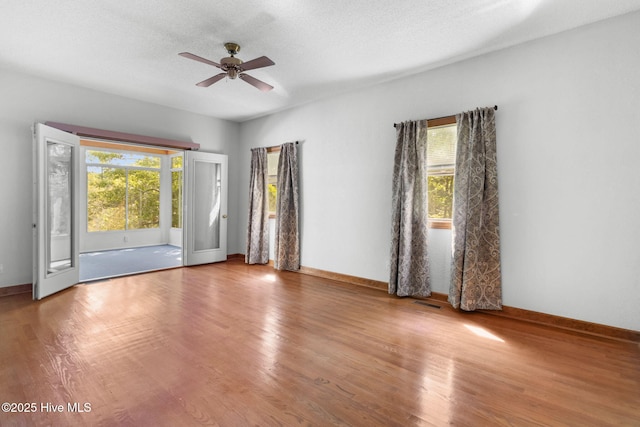 163 Middleton Dr, Hertford, NC 27944 - empty room with ceiling fan, wood finished floors, and plenty of natural light