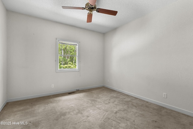 163 Middleton Dr, Hertford, NC 27944 - unfurnished room featuring carpet floors, baseboards, visible vents, a ceiling fan, and a textured ceiling
