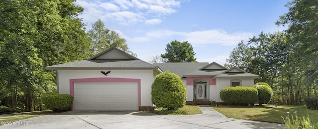 163 Middleton Dr, Hertford, NC 27944 - ranch-style house featuring stucco siding, concrete driveway, a front yard, and a garage