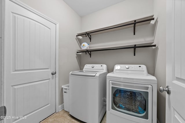 371 Porter Mills Rd, Greenville, NC 27858 - laundry room featuring light tile patterned floors, laundry area, and independent washer and dryer