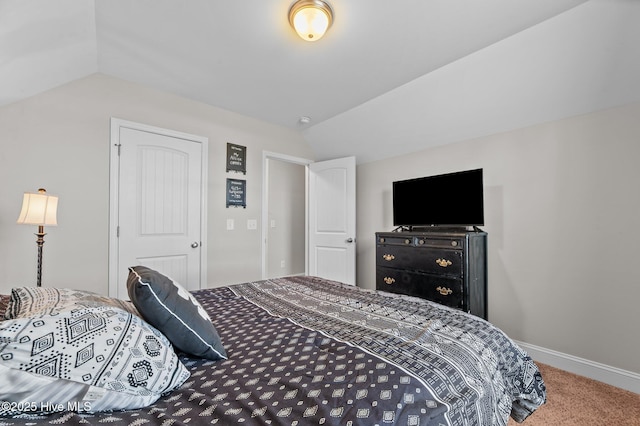 371 Porter Mills Rd, Greenville, NC 27858 - bedroom featuring vaulted ceiling, baseboards, and carpet floors