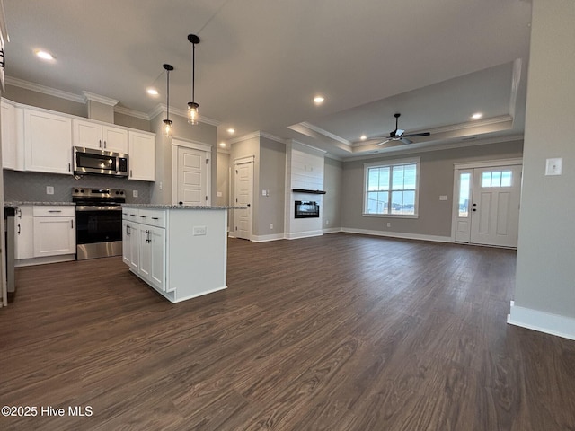 203 Crown Dr, Washington, NC 27889 - kitchen with a ceiling fan, appliances with stainless steel finishes, a kitchen island, and ornamental molding