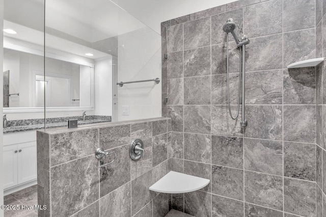 661 Jenoa Loop, Castle Hayne, NC 28429 - bathroom with a tile shower, vanity, and recessed lighting