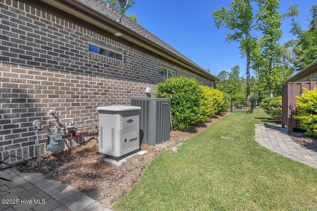 661 Jenoa Loop, Castle Hayne, NC 28429 - view of yard featuring central AC unit
