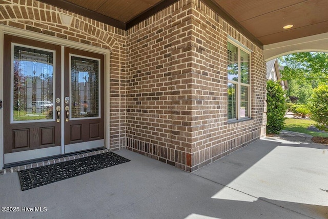 661 Jenoa Loop, Castle Hayne, NC 28429 - property entrance featuring brick siding and a porch