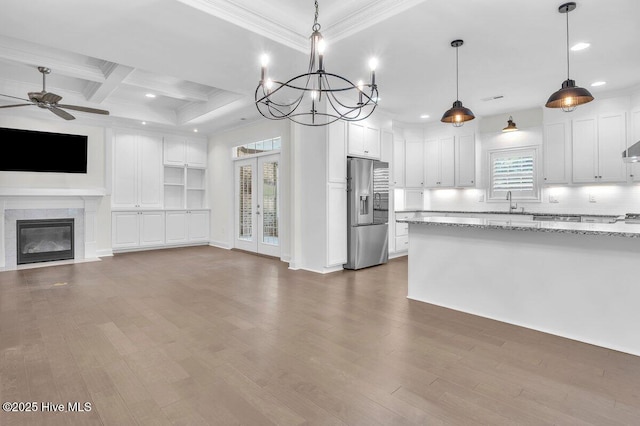 661 Jenoa Loop, Castle Hayne, NC 28429 - kitchen featuring stainless steel fridge with ice dispenser, open floor plan, a ceiling fan, white cabinets, and crown molding