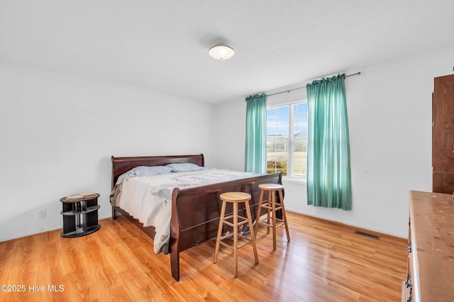 194 Blanks Rd, Clarkton, NC 28433 - bedroom with baseboards, visible vents, and light wood-style flooring