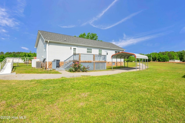 194 Blanks Rd, Clarkton, NC 28433 - rear view of property featuring fence, a yard, cooling unit, a wooden deck, and a detached carport