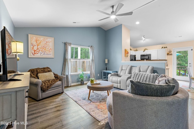 1516 Round Ridge Rd SE, Bolivia, NC 28422 - living room featuring ceiling fan, wood finished floors, and vaulted ceiling