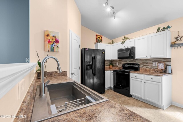 1516 Round Ridge Rd SE, Bolivia, NC 28422 - kitchen with white cabinets, a sink, lofted ceiling, tasteful backsplash, and black appliances
