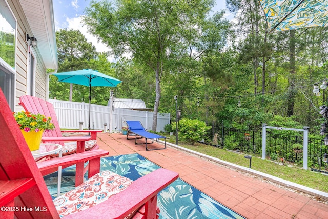 1516 Round Ridge Rd SE, Bolivia, NC 28422 - view of patio featuring a fenced backyard