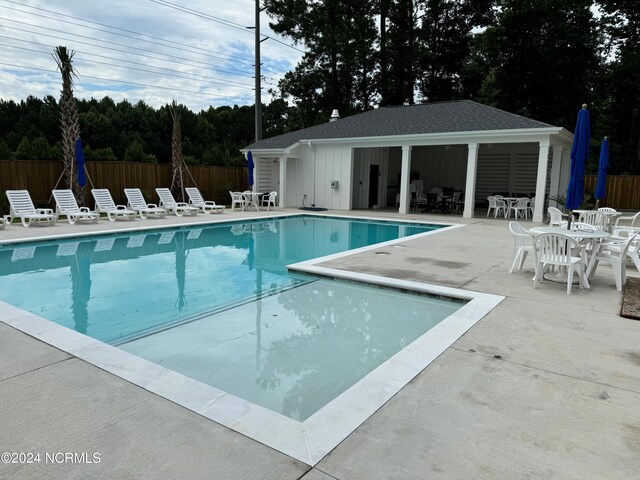 5034 Northstar Dr Unit 68, Leland, NC 28451 - pool with fence, an outbuilding, and a patio area