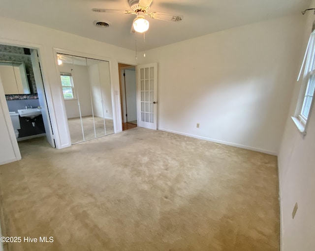 101 N Channel Haven Dr, Wilmington, NC 28409 - unfurnished bedroom with a sink, carpet flooring, a closet, and french doors