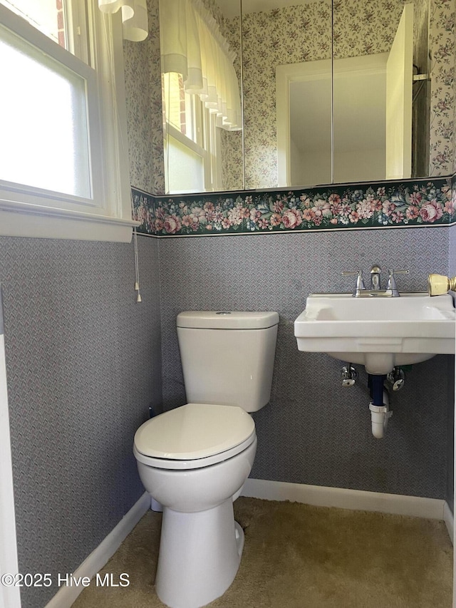 101 N Channel Haven Dr, Wilmington, NC 28409 - bathroom featuring wallpapered walls, wainscoting, and toilet