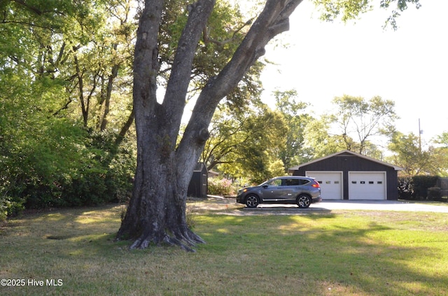 101 N Channel Haven Dr, Wilmington, NC 28409 - view of grassy yard featuring driveway and a garage