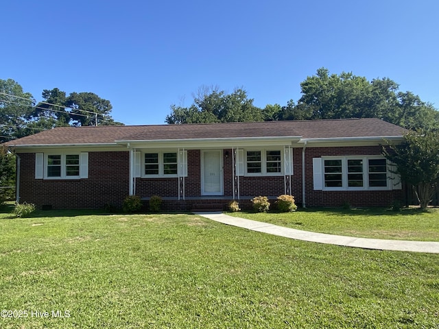 101 N Channel Haven Dr, Wilmington, NC 28409 - ranch-style house with a front yard and brick siding