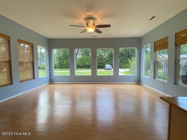 101 N Channel Haven Dr, Wilmington, NC 28409 - unfurnished sunroom featuring french doors, wood finished floors, and baseboards