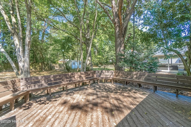 1111 W Williams Cir, Elizabeth City, NC 27909 - deck featuring a fenced backyard, an outdoor structure, and a shed