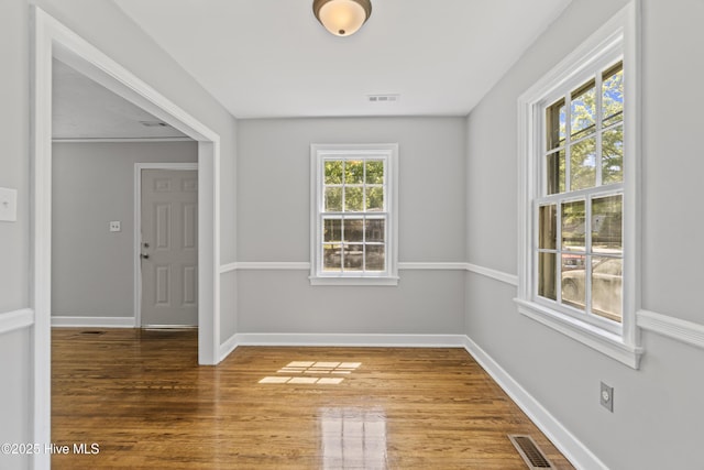 1111 W Williams Cir, Elizabeth City, NC 27909 - empty room with baseboards, wood finished floors, and visible vents