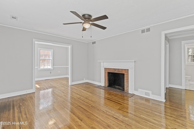 1111 W Williams Cir, Elizabeth City, NC 27909 - unfurnished living room with a ceiling fan, crown molding, visible vents, and light wood-style flooring