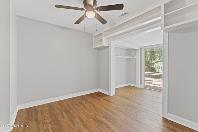 1111 W Williams Cir, Elizabeth City, NC 27909 - unfurnished bedroom featuring wood finished floors, visible vents, a ceiling fan, and baseboards