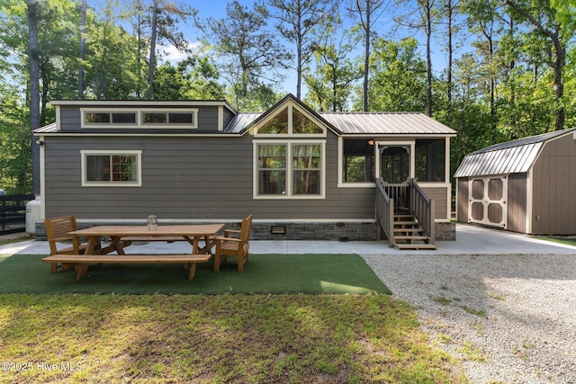 280 Charlie Rd, Arapahoe, NC 28510 - rear view of house with a patio, a shed, crawl space, a lawn, and an outbuilding