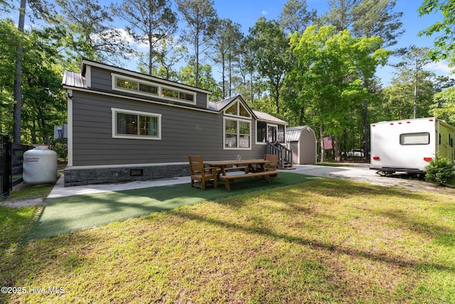 280 Charlie Rd, Arapahoe, NC 28510 - rear view of property featuring a yard and crawl space