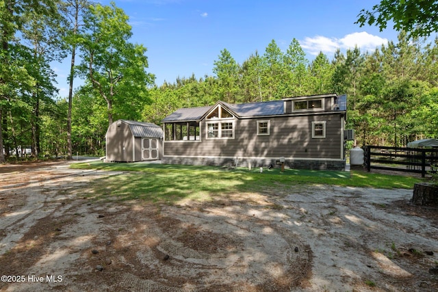 280 Charlie Rd, Arapahoe, NC 28510 - back of property with a storage shed, fence, and an outdoor structure