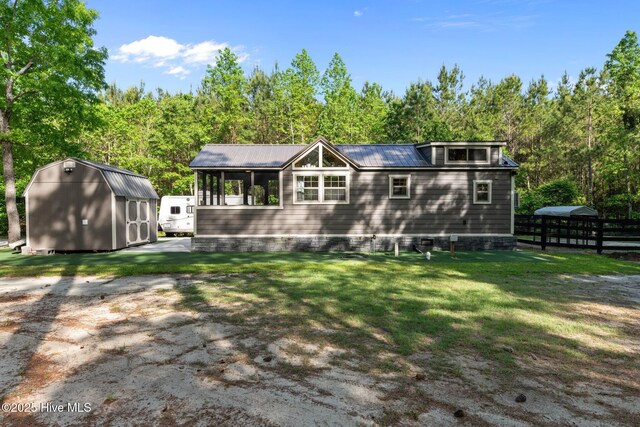 280 Charlie Rd, Arapahoe, NC 28510 - back of property featuring a yard, metal roof, and crawl space