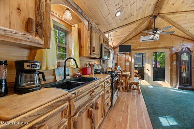 280 Charlie Rd, Arapahoe, NC 28510 - kitchen featuring a sink, wood walls, wood ceiling, and range with gas cooktop