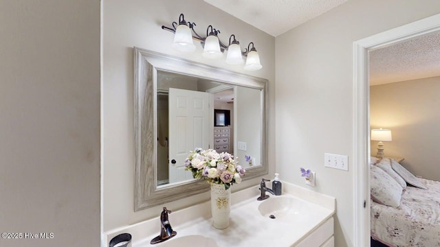 106 Ehrhardt Way, Princeton, NC 27569 - ensuite bathroom featuring a sink, ensuite bathroom, double vanity, and a textured ceiling