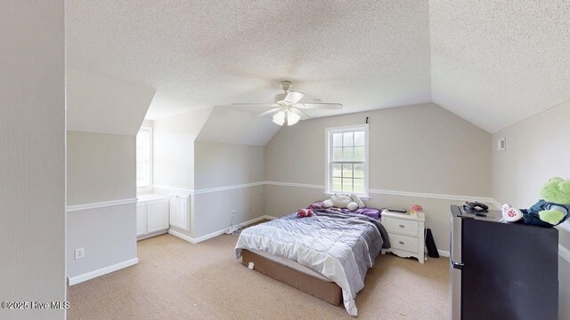 106 Ehrhardt Way, Princeton, NC 27569 - bedroom featuring baseboards, ceiling fan, light colored carpet, a textured ceiling, and vaulted ceiling